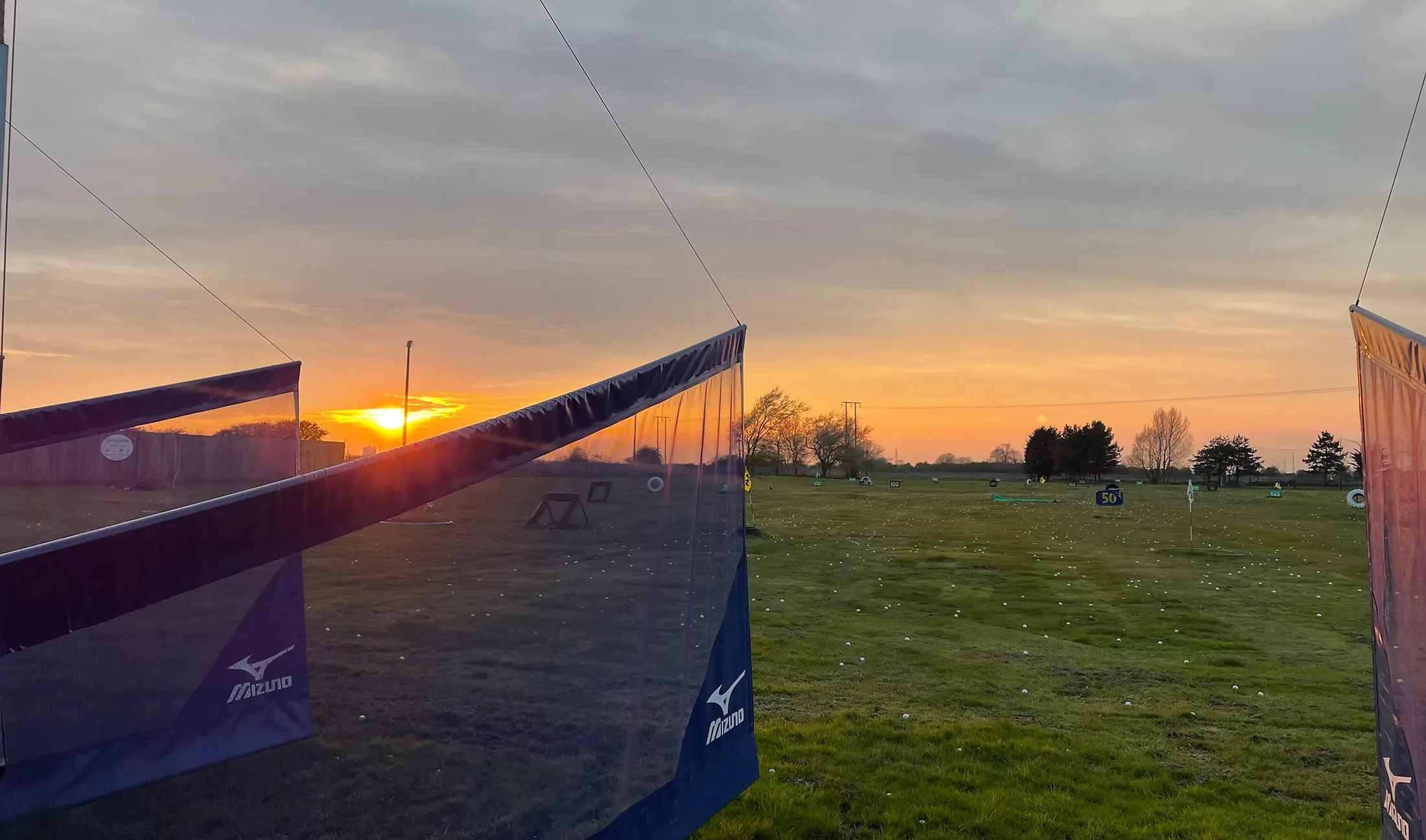 The Country Golf driving range at dusk